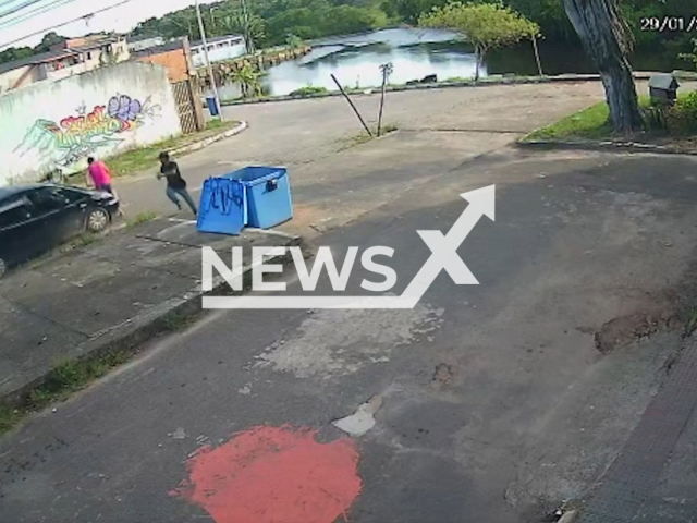 Claudineia Rocha is hit by  a car running from police in Serra, Brazil, on Sunday, Jan. 29, 2023. She was trying to save her six-year-old son Yuri who was playing on the street, she was injured the child was not. Note: Picture is a screenshot from a video (Newsflash)