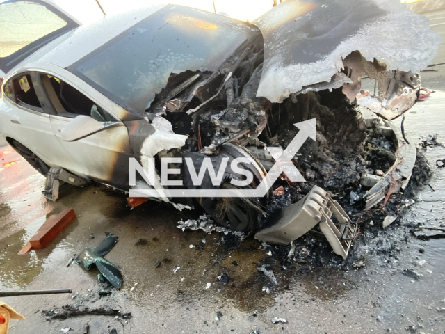 Picture shows a Tesla that ignited, undated. The fire was extinguished with approx 6,000 gallons of water, as the battery cells continued to combust. Note: Photo from Fire brigade. (@metrofirepio/Newsflash)