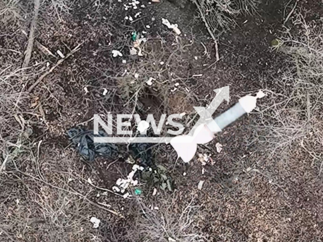 Bomb falls on a Russian soldier in a field area in Ukraine in undated footage. The footage was released by the 46th brigade of the Ukrainian Air Assault Forces on Thursday, Feb. 2, 2023.  Note: Picture is screenshot from a video. (@oaembr46/Newsflash)