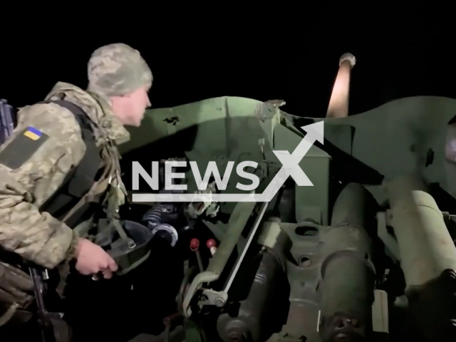 Ukrainian soldier aims an anti-tank artillery gun during combat training at night in Ukraine in undated footage. The footage was released by the Navy of the Armed Forces of Ukraine on Sunday, Feb. 5, 2022.Note: Picture is screenshot from a video. (@navy.mil.gov.ua/Newsflash)