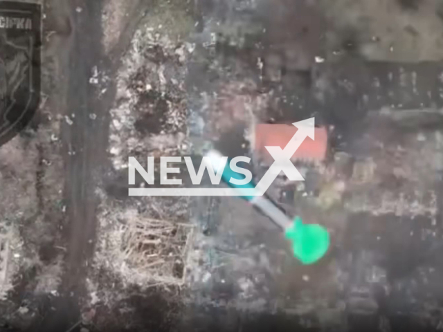 Drone bomb falls on Russian soldiers moving in a residential area in Ukraine in undated footage. The footage was released by the 92nd brigade of the Ukrainian Ground Forces on Saturday, Feb. 4, 2023.Note: Picture is screenshot from a video. (@92OMBr/Newsflash)