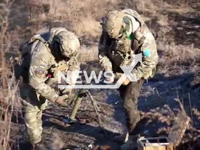 Ukrainian soldiers load rockets into mortars during combat training in Ukraine in undated footage. The footage was released by the "East" Regional Directorate of the Ukrainian Territorial Defense Forces on Saturday, Feb. 4, 2023.Note: Picture is screenshot from a video. (@troskhidzsu/Newsflash)