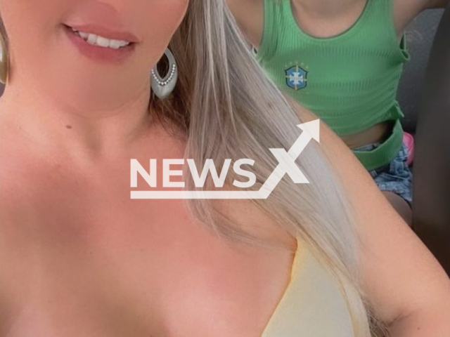 Isabel Aparecida de Sousa, 37, poses with unidentified child,  in undated photo. Her ex Paulo Roberto Moreira Soares, 38, allegedly  did not accept the end of the relationship, and killed her, in Ceilandia , Brazil, on Saturday  Jan. 4, 2023.  
Note: Private photo. (Newsflash)