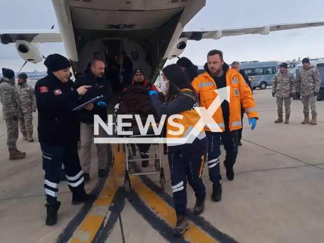 Turkish emergency services evacuate injured citizens at an airport in Turkey, in undated footage. The earthquakes in Turkey have left thousands of people injured. Note: Picture is screenshot from a video. (TR Ministry of National Defense/Newsflash)