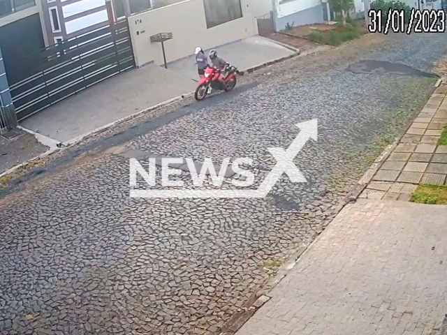 A 32-year-old man on a motorcycle gropes pedestrian while driving in Ponta Grossa, Brazil, on Tuesday, Jan. 31, 2023. He fell off the motorcycle  soon after the assault and  was indicted for sexual harassment by police.  Note: Picture is a screenshot from a video (Newsflash)