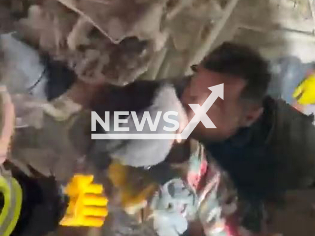 A rescuer pull out a boy, named Miran, from under the rubble in Malatya, Turkey, Tuesday, Feb. 7, 2023. Thousands of people died and were injured as a result of a massive earthquake in Turkey, Monday, Feb. 6, 2023.Note: Picture is screenshot from a video. (@EmniyetGM/Newsflash)