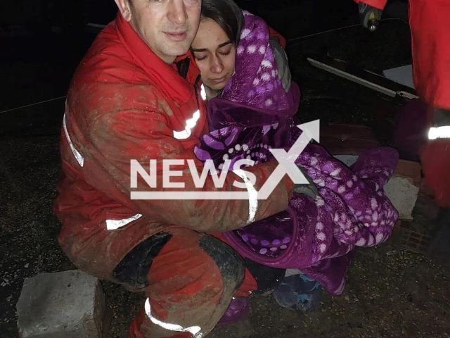 Photo shows Sevval Deniz with a rescuer, undated. She was rescued under the rubble in Hatay, Turkey. Note: Picture is from Kutahya Municipality (Kutahya Municipality/Newsflash)