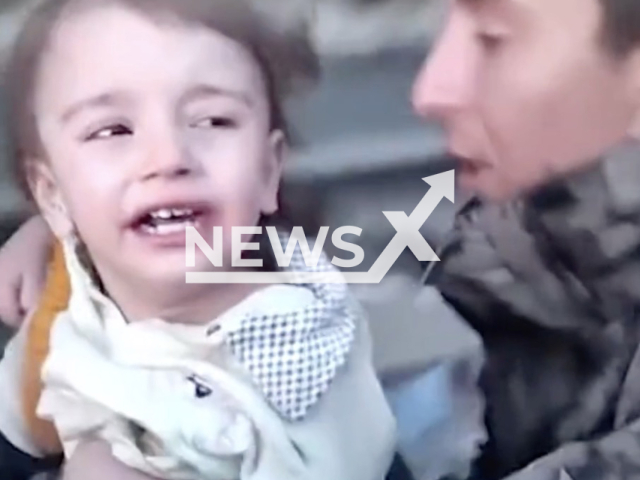 Rescuers pull out twin toddlers under the rubble in Gaziantep, Turkey, Tuesday, Feb. 7, 2023. Ahmet Erbay, and his twin sister Amine Elcin, were sent to the hospital. Note: Picture is a screenshot from a video (@EmniyetGM/Newsflash)