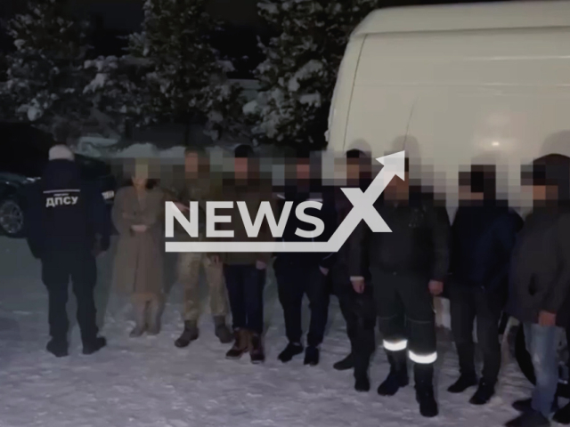 Picture shows detained Ukrainian residents by the Ukrainian border guards  in the Chernivtsi Oblast in Ukraine in undated footage. The footage was released by the State Border Service of Ukraine on Tuesday, Feb, 7, 2023.  Note: Picture is screenshot from a video. (@BorderGuardService/Newsflash)