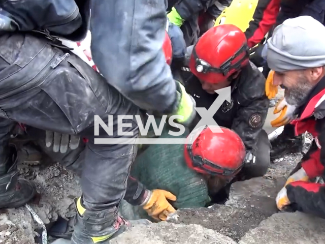 Emergency services rescue a woman in Diyarbakir, Turkey, in undated footage. Thousands of people have been left injured and homeless as a result of the earthquakes. Note: Picture is screenshot from a video. (@EmniyetGM/Newsflash)