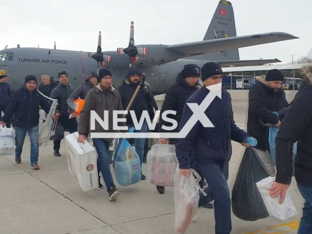 Mine workers walk at an airport in Adiyaman, Turkey, in undated footage. The mine workers were transported by the Turkish Air Force. Note: Picture is a screenshot from a video (TR Ministry of National Defense/Newsflash)