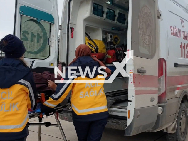 Emergency services escort an earthquake victim to an ambulance in Ankara, Turkey, in undated footage. Thousands of people have been left injured and homeless as a result of the earthquake. Note: Picture is screenshot from a video. (TR Ministry of National Defense/Newsflash)