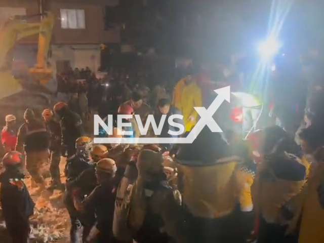 Rescuers carry a woman on a stretcher after she was pulled out from under the rubble in Sanliurfa, Turkey, undated. Thousands of people died and were injured as a result of a massive earthquake in Turkey, Monday, Feb. 6, 2023. Note: Picture is a screenshot from a video (@valisalihayhan/Newsflash)