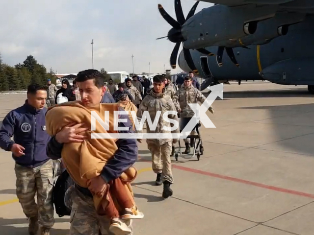 Emergency rescue crew rescuing the injured and survived from the earthquake in Turkey, undated. With roads badly damaged in the earthquake, the Turkish defence ministry has mobilised a fleet of aircraft operating along a specially created air corridor to fly rescuers and equipment into the region.Note: Picture is a screenshot from a video. (TR Ministry of National Defense/Newsflash)