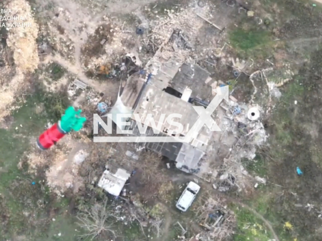 Ukrainian border guards drop bombs on Russian soldiers using drones in the south of Ukraine in undated footage. The footage was released by the State Border Service of Ukraine on Friday, Feb. 9. 2023. Note: Picture is a screenshot from a video (@BorderGuardService/Newsflash)