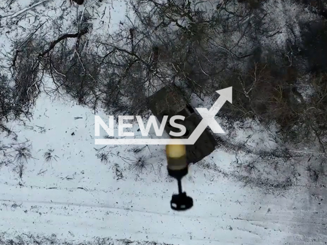 Ukrainian territorial defense fighters drop bombs on the Russian BMP in Ukraine in undated footage. The footage was released by the Zaporizhia separate territorial defense brigade on Friday, Feb. 10, 2023.Note: Picture is screenshot from a video. (@110tro/Newsflash)