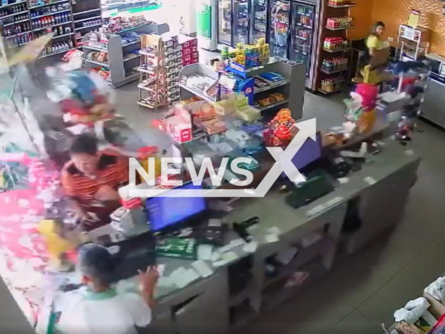 A car drives into customer at the  register at a convenience store of a gas station in Ponta Grossa, Brazil, on Tuesday, Feb. 7, 2023. The  driver got out of the car and out of the store without showing any pain or shock. Note: Picture is a screenshot from a video (Newsflash)