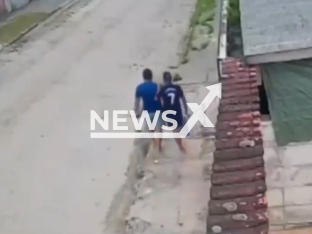 A thief missing a leg hops down the road holding on to  his accomplice steal a car, in Sao Vicente, Brazil, on Friday, Feb. 10, 2023. They threatened a woman and her 11-year-old daughter and stole her car.  Note: Picture is screenshot from a video. (Newsflash)