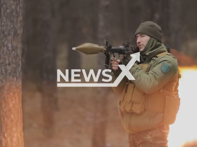 Ukrainian soldier shoots MANPADS during combat training in a forested area in Ukraine in undated footage. The footage was released by the the Zaporizhzhia separate territorial defense brigade on Monday, Feb. 13, 2022.Note: Picture is screenshot from a video. (@110tro/Newsflash)