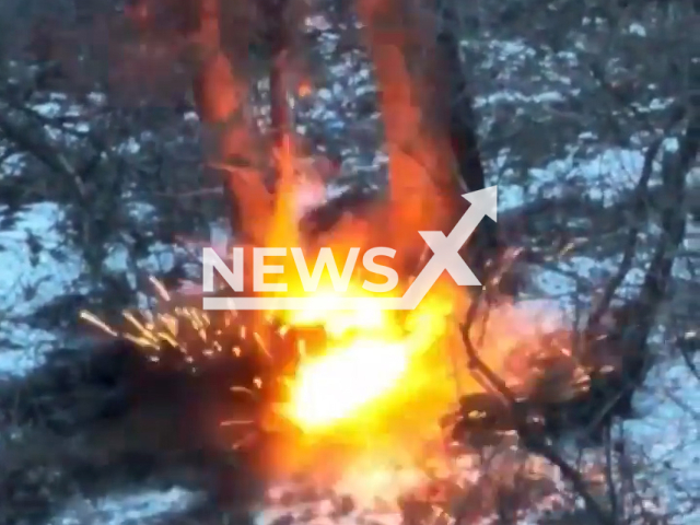 Picture shows an explosion among trees in snow near Bakhmut, Donetsk region, Ukraine in undated footage. The footage was released by the 30th brigade of the Ukrainian Ground Forces on Tuesday, Feb. 14, 2022.Note: Picture is screenshot from a video. (@30brigade/Newsflash)