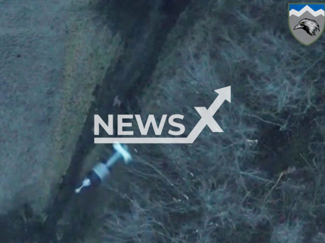 Ukrainian drone bomb falls on running Russian soldiers in Ukraine in undated footage. The footage was released by the 109th battalion of the Ukrainian Ground Forces on Wednesday, Feb. 15, 2022. Note: Picture is a screenshot from a video (@109OGSHB/Newsflash)