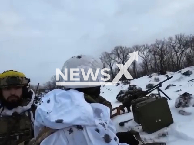 Picture shows Ukrainian soldiers in a snowy trench near Bakhmut, Donetsk region, Ukraine in undated footage. The footage was released by the 24th battalion of the Ukrainian Ground Forces on Tuesday, Feb. 14, 2022. Note: Picture is a screenshot from a video (@aidar24/Newsflash)