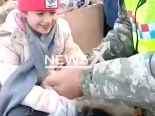 Emergency service operator gives boots to a little earthquake victim in Turkey in undated footage. Thousands of people have been left injured as a result of the earthquake. Note: Picture is a screenshot from a video (@jandarma/Newsflash)