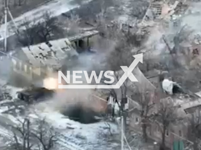 Ukrainian tank shoots at Russian troops hiding in a residential building in Bakhmut, Donetsk region, Ukraine in undated footage. The footage was released by the 241st brigade of territorial defense of the city of Kyiv on Wednesday, Feb. 15, 2022. Note: Picture is screenshot from a video. (@241obrtro/Newsflash)