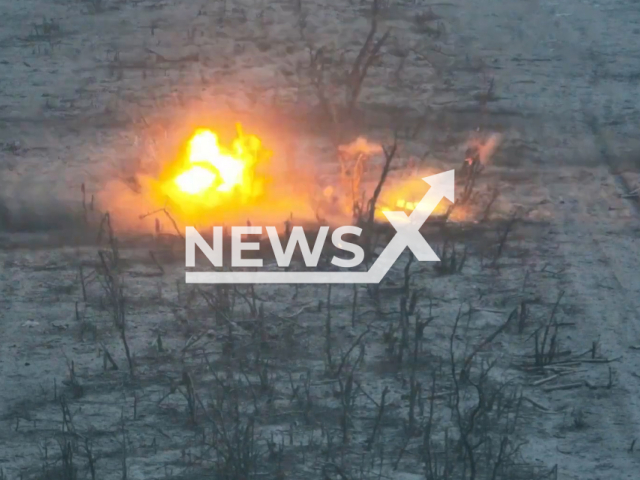 Picture shows an explosion among trees in Donetsk region, Ukraine in undated footage. The footage was released by the National Guard of Ukraine on Thursday, Feb. 16, 2022.Note: Picture is screenshot from a video. (@NGU/Newsflash)