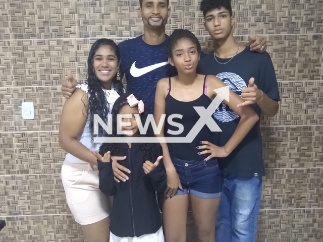 Father  Rafael Moraes Rangel, 37, and daughter  Isa Rebeka Oliveira Rangel, 12, (bottom row left) pose with family in undated photo. They were found dead after disappearing into the sea in Bertioga, Brazil, on Tuesday, Feb. 14, 2023.  
Note: Private photo. (Newsflash)