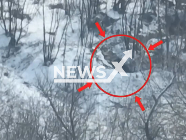 Russian soldiers hide in a snowy foxhole in Ukraine in undated footage. The footage was released by the 3rd brigade of the Ukrainian Ground Forces on Thursday, Feb. 16, 2022.Note: Picture is screenshot from a video. (@ab3.army/Newsflash)