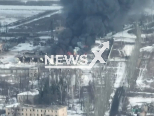 Picture shows a burning residential area in Ukraine in undated footage. The footage was released by the 28th brigade of the Ukrainian Ground Forces on Friday, Feb. 17, 2022. Note: Picture is screenshot from a video. (@28mechanizedbrigade/Newsflash)