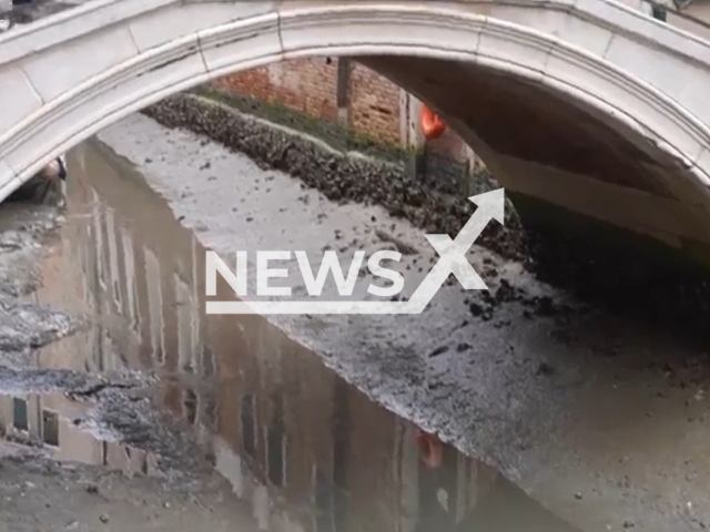 Picture shows the dry canals in Venice, Italy, undated. The waterless canals reportedly surprise the visitors. Note: Image is a screenshot from video. (Newsflash)