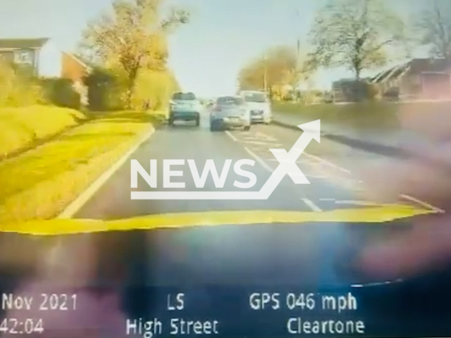 Wiltshire Police officer engages in hot pursuit chasing 52-year-old Darren Reed in Royal Wootton Bassett, England, on Nov. 9, 2021. Mr. Reed has been jailed for 10 months and disqualified from driving for four years. Note: Picture is screenshot from a video. (@wiltshirepolice/Newsflash)