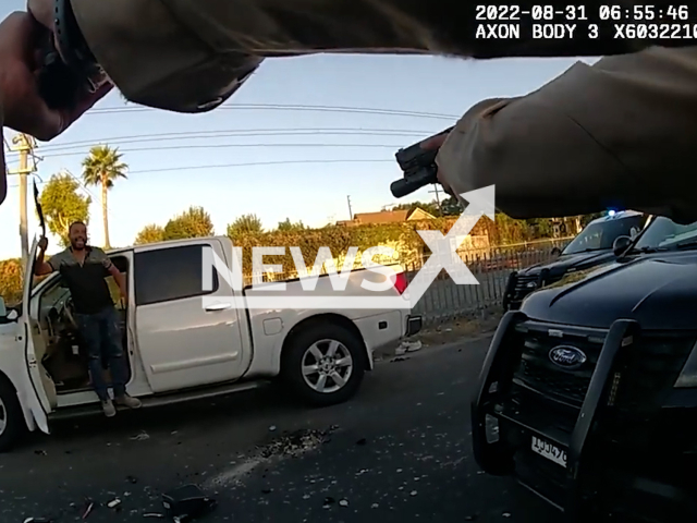 Flores Augustin, 41 waving the machete before he was fatally shot at the 9200 block of Graham Avenue in LA, California on the 31st of August, 2022 Note: Picture is screenshot from a video. (Los Angeles County Sheriff's Department/Newsflash)