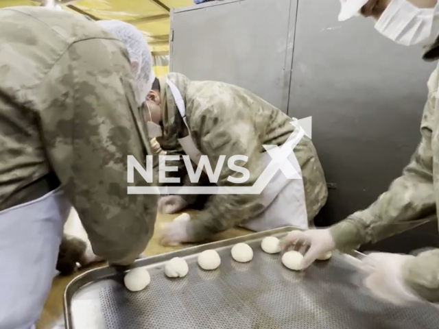 Personnel in military uniforms bake bread and distribute hot soup to citizens in Turkey, undated. A 7.7-magnitude earthquake struck the district of Pazarcik in Kahramanmaras Province at 4.17am on 6th February 2023.Note: Picture is screenshot from a video. (@TCMilliSavunmaBakanligi/Newsflash)