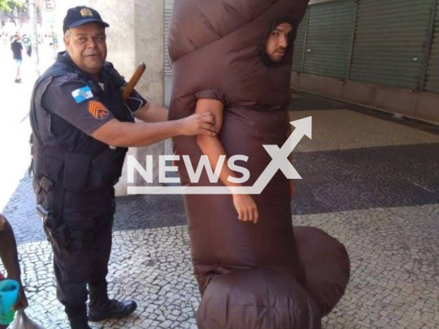 Police officer arrests a man dressed as a penis, in Rio de Janeiro, Brazil, on Sunday, Feb. 19, 2023.   He was detained after several people complained about his behaviour, he was trying  to pursue women. Note: Private photo. (Newsflash)