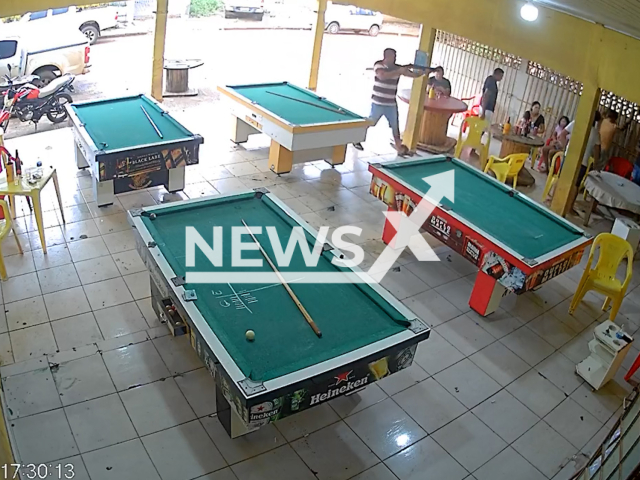 Edgar Ricardo de Oliveira, 30, and Ezequias Souza Ribeiro, 27,  shooting people in a bar, in Sinop, Brazil, on Tuesday, Feb, 21, 2023.  The two men killed six people after the lost money on pool . Note: Picture is screenshot from a video. (Newsflash)