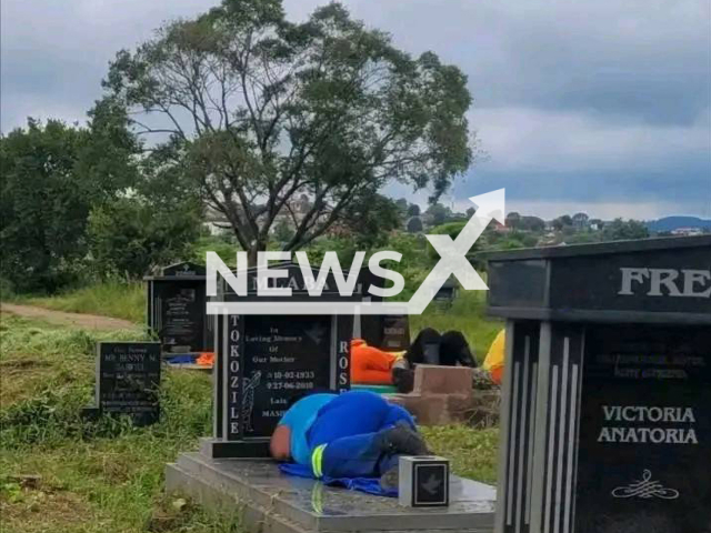 Photo shows Msunduzi municipal workers sleeping and sitting on graves in Msunduzi in Umgungundlovu District Municipality, KwaZulu-Natal, South Africa, undated. Municipal spokesperson Ntobeko Mkhize confirmed the employees, who were captured sleeping and sitting on top of graves, would be charged for misconduct. Note: Picture is private (Newsflash)