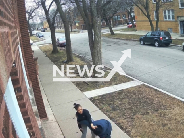 Off-duty Chicago police officer holds down Leevon Smith, in Chicago, Illinois, on Wednesday, Jan. 18, 2023. The officer shot Smith several times who ultimately succumbed to his injuries and passed away. Note: This picture is a screenshot from the video. (Chicago Police Department/Newsflash)