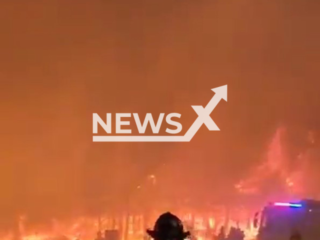 Picture shows the scene of the fire in the Biobio Region, Chile, on Friday, Feb. 17, 2023. At least 25 people have died as a result of the wildfires across Chile. Note: Picture is a screenshot from a video. (@BomberosdeChile/Newsflash)