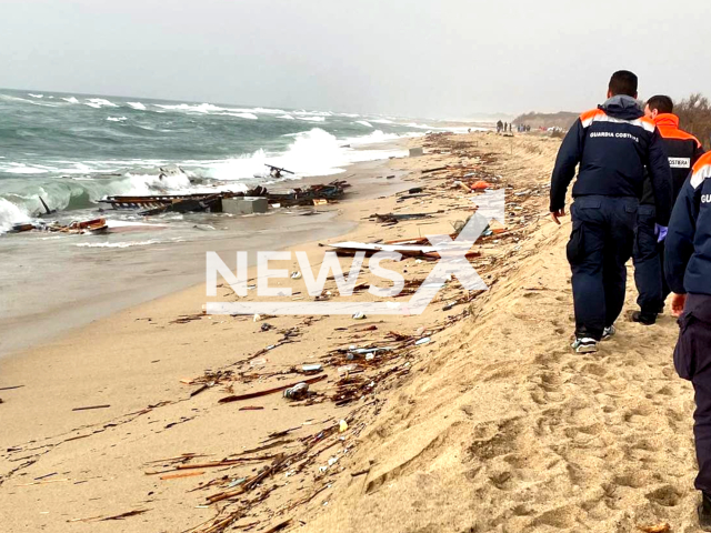 Remains of a wooden boat wash up on the beach after it smashed into rocky reefs in Steccato di Cutro, Calabria, Italy, Sunday, Feb. 26, 2023. The vessel had set sail from Turkey several days ago with migrants from Afghanistan, Iran and several other countries and crashed in stormy weather. Note: Photo is from the Italian Coast Guard (@guardiacostiera/Newsflash)