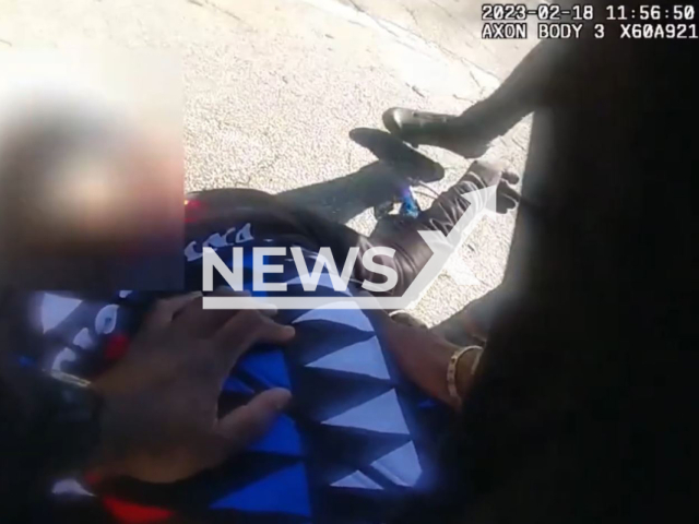 Zone 4 Day Watch officer Tulloch saves a cyclist's life, in Atlanta, Georgia, on Saturday, Feb. 18, 2023. Officer Tulloch remained calm throughout the whole endeavour. Note: Picture is screenshot from a video. (@atlantapolicedepartment/Newsflash)