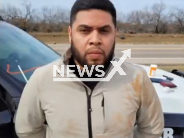 Immigrant smuggler poses in an undated photo. DPS trooper arrested the smuggler, in Dimmit County, Texas. Note: Police photo. (@TxDeptPublicSafety/Newsflash)