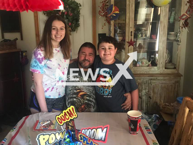 Photo shows Steven Cain, 50, with his children, undated. He died in Ohio Township in Clermont County, Ohio, USA, Monday, Feb. 27, 2023. Note: Picture is private (Steve Cain/Newsflash)