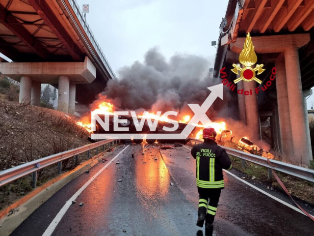 Photo shows the scene after a driver lost control of his heavy goods vehicle, crashing through safety barriers before plunging off the bridge and exploding into flames in Calenzano, Tuscany, Italy, Sunday, Feb. 26, 2023. The driver died trapped in his cabin. Note: Photo is from the Firefighters of Italy (Vigili del Fuoco/Newsflash)