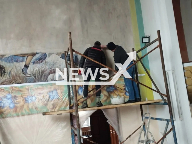 Workers paint over the  fresco 'Miracle on the Vistula' in Soly, Belarus, in February, 2023.
It was painted over, causing Lukasz Jasina, spokesman for the Ministry of Foreign Affairs of Poland to say 'We condemn the destruction of Polish cultural heritage in Belarus by Lukashenko's regime.'
Note: Private photo.  (Witek Korybut-Daszkiewicz/Newsflash)