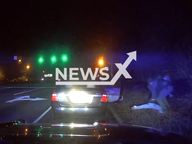 A police officer searching the teenager who was shot in Greenville County, South Carolina, USA on Jan, 17, 2023. The South Carolina Law Enforcement Division is currently investigating the incident.Note: Picture is screenshot from a video. (Greenville County Sheriff's Office-SC/Newsflash)