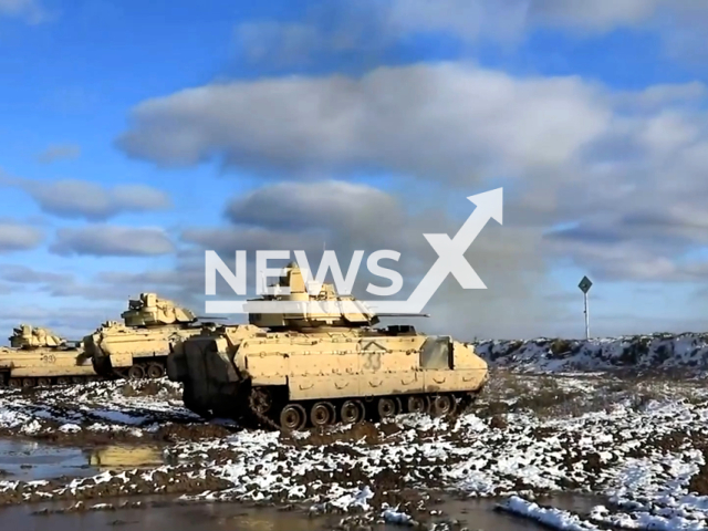 Picture shows three tanks at Bemowo Piskie, Poland, on Monday, Feb. 27, 2023. U.S. Soldiers assigned to NATO eFP Battle Group Poland, 2nd Armored Brigade Combat Team, 1st Cavalry Division, supporting the 4th Infantry Division (4 ID) participated in a combined arms live fire exercise. Note: Picture is a screenshot from a video. (Lianne Hirano; U.S. Army National Guard/Newsflash)