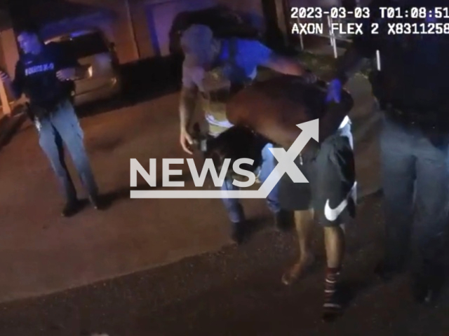 A police officer arrests the suspect after he crushed into another car in Volusia, Florida, USA on March 3, 2023.  One person was injured in the crash and taken to the hospital. Note: Picture is a screenshot from the video. (Volusia Sheriff's Office/Newsflash)